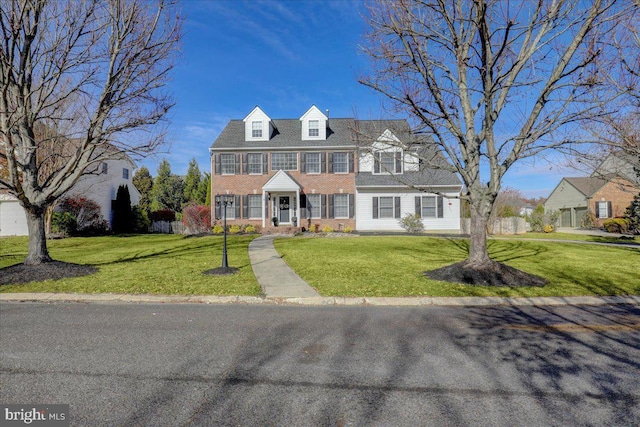 view of front of property with a front lawn