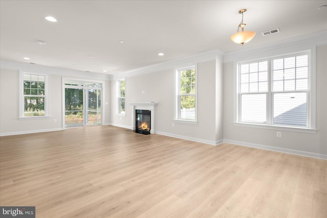 unfurnished living room with light wood-type flooring and ornamental molding