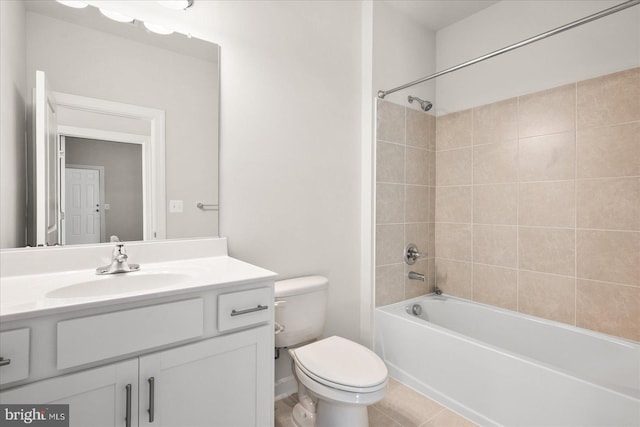 full bathroom featuring tile patterned floors, vanity, toilet, and tiled shower / bath