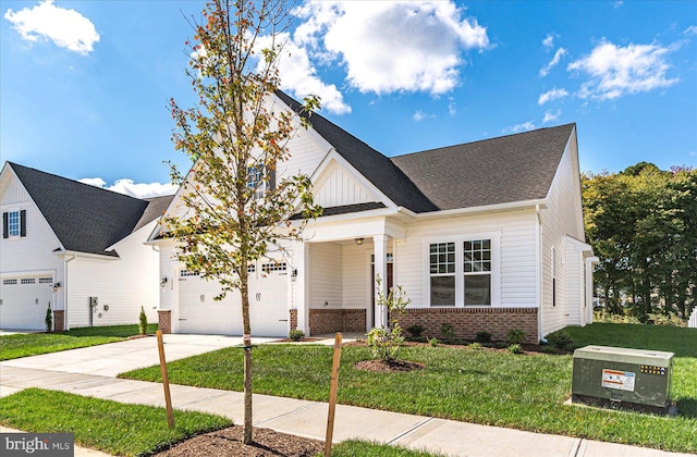 view of front of property featuring a garage and a front lawn