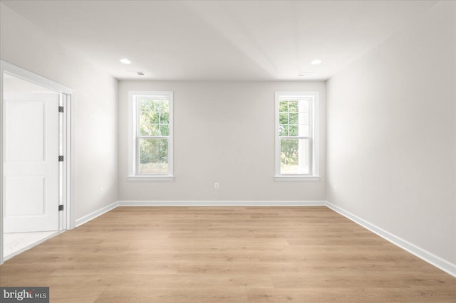 unfurnished room with light hardwood / wood-style flooring