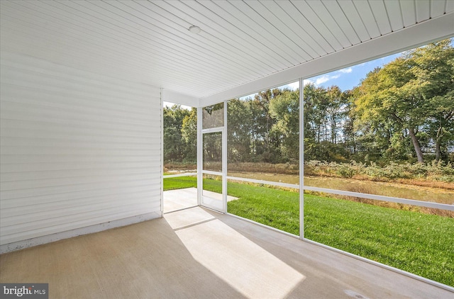 unfurnished sunroom with plenty of natural light