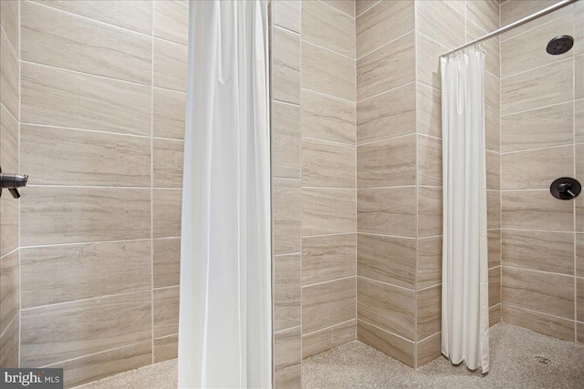 bathroom with a shower with shower curtain