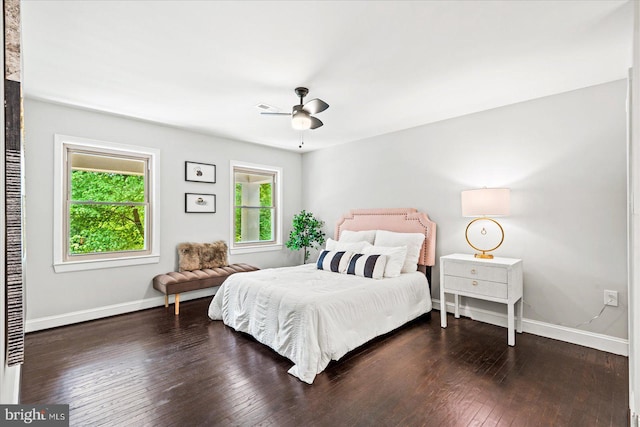 bedroom with ceiling fan and dark wood-type flooring