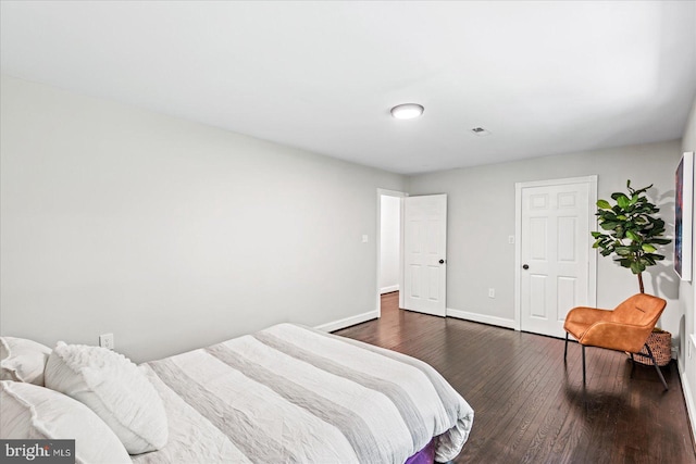 bedroom featuring dark wood-type flooring