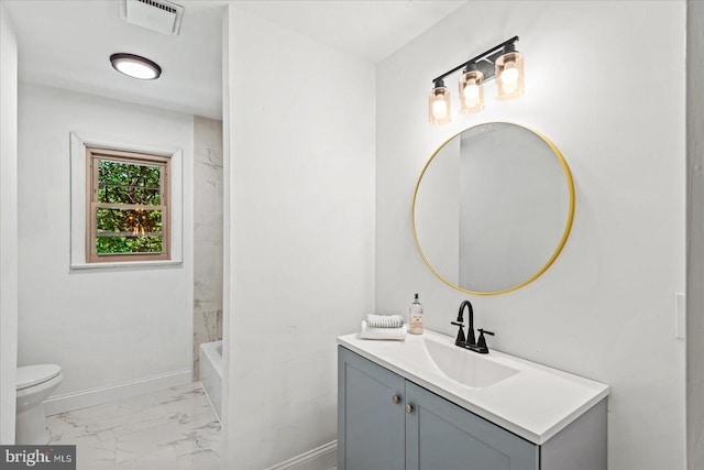 bathroom with vanity and toilet