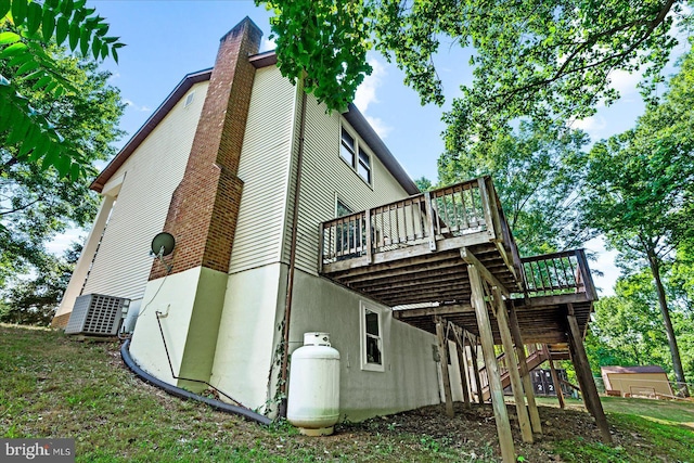 view of home's exterior with a wooden deck