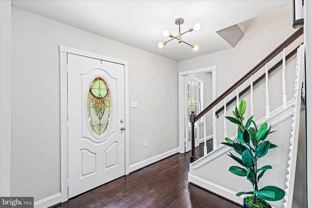 foyer featuring dark hardwood / wood-style floors and a notable chandelier