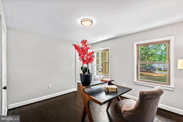 dining space with dark hardwood / wood-style floors