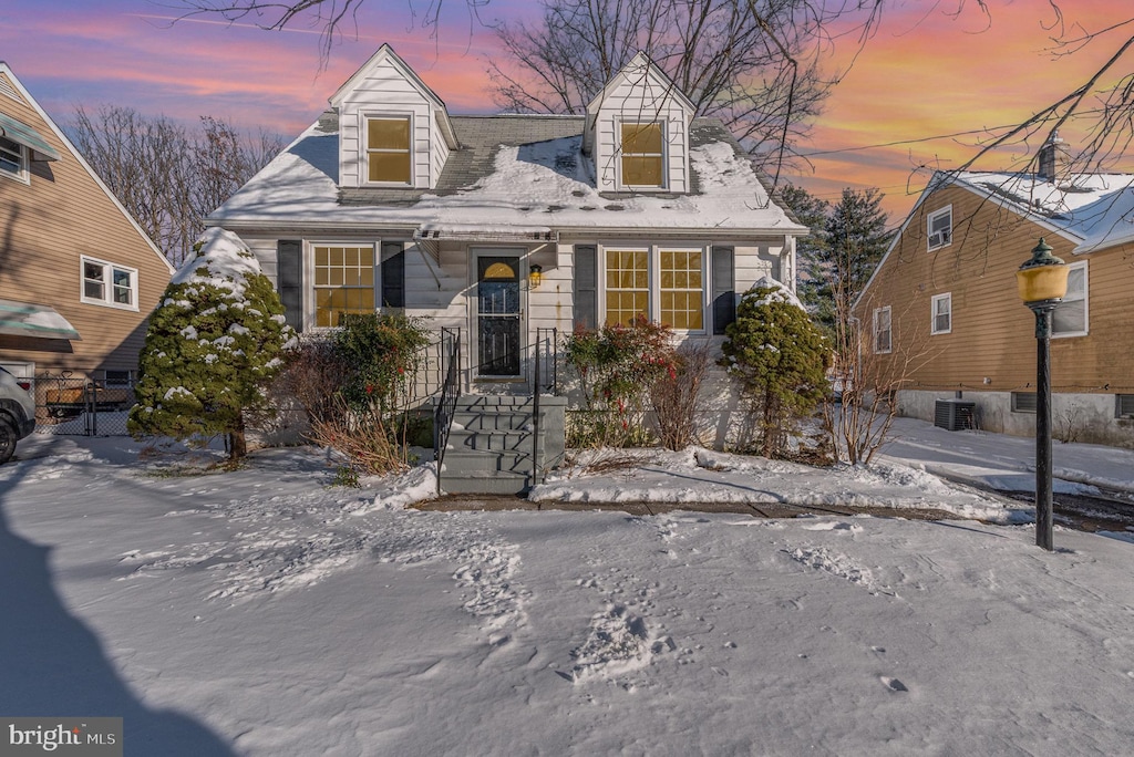 new england style home with central AC