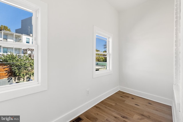 spare room featuring hardwood / wood-style flooring