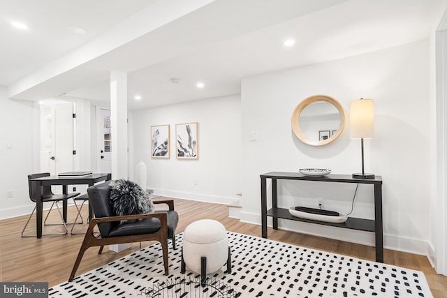 sitting room featuring light hardwood / wood-style flooring