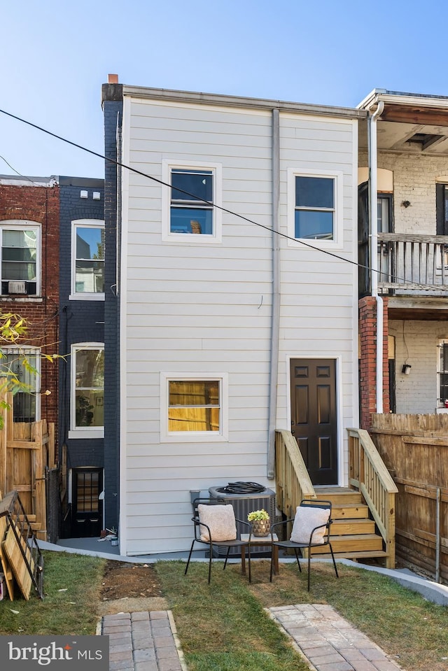 back of property with central air condition unit