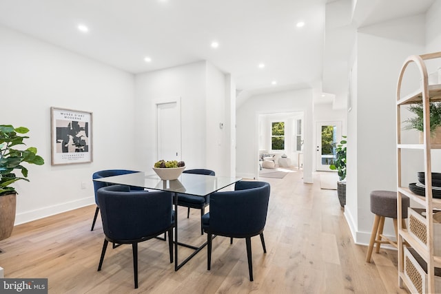 dining area featuring light wood-type flooring