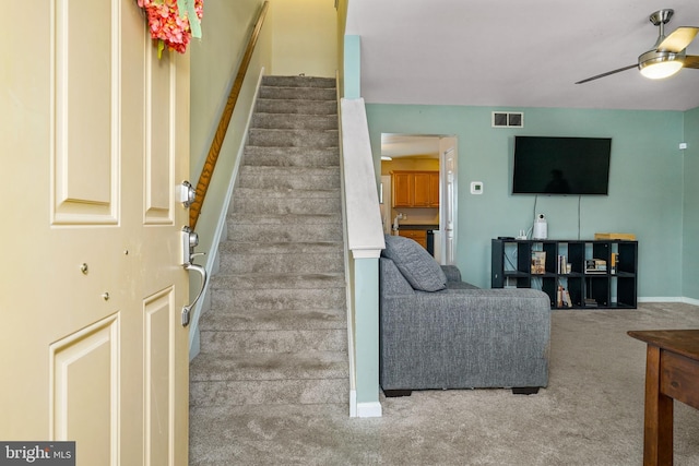 interior space featuring ceiling fan