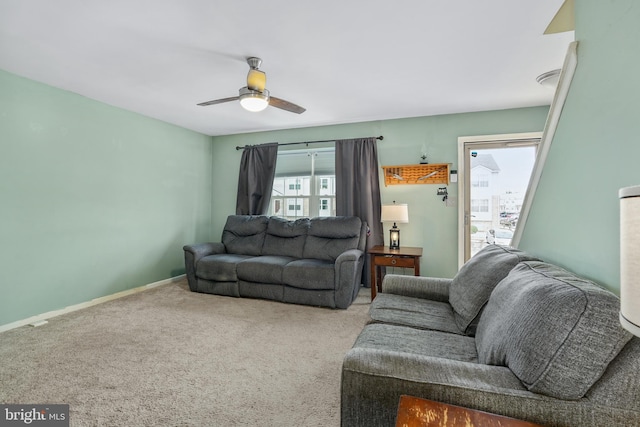 living room featuring carpet and ceiling fan