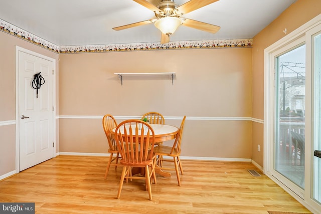 dining room featuring ceiling fan and light hardwood / wood-style floors