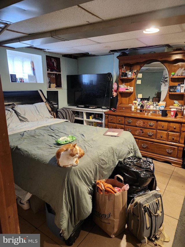 bedroom with light tile patterned floors