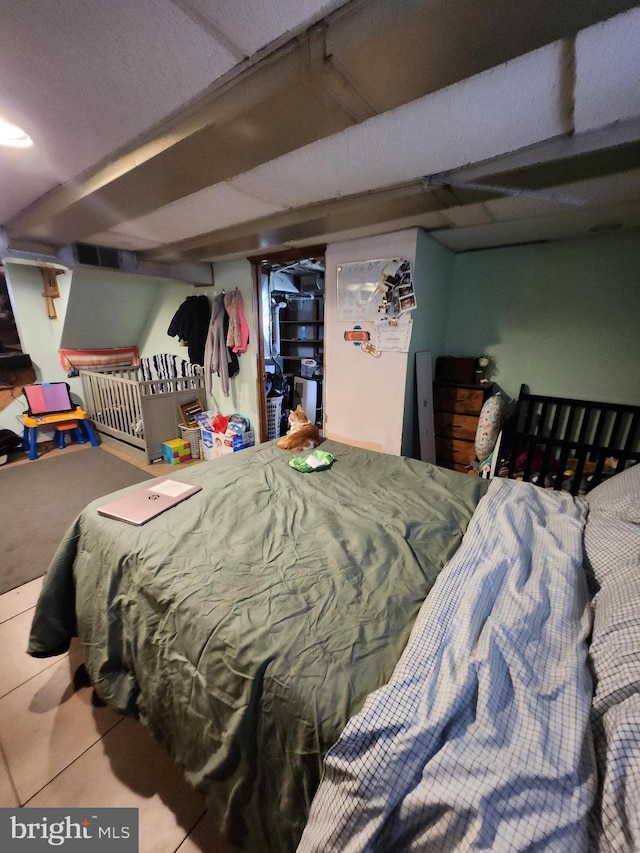 bedroom featuring tile patterned floors