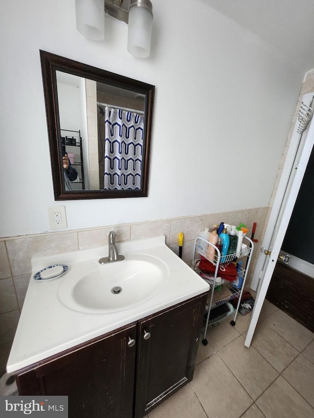 bathroom with tile patterned flooring, vanity, and a shower with shower curtain