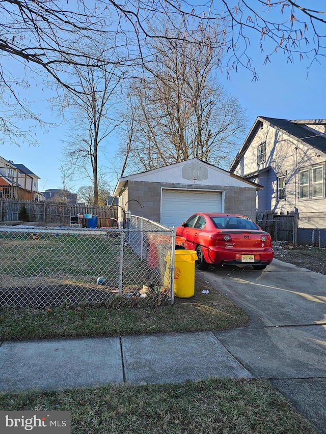 view of home's exterior featuring an outbuilding and a garage