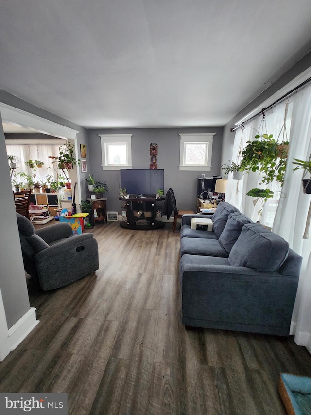 living room featuring dark wood-type flooring