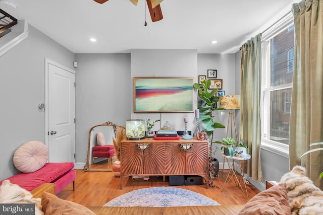 sitting room featuring ceiling fan and light hardwood / wood-style floors