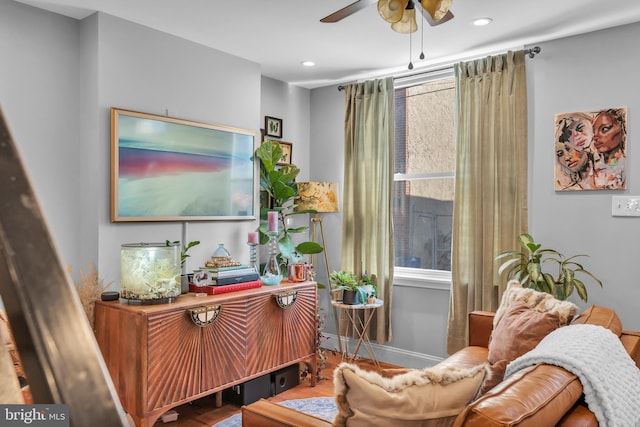 sitting room featuring ceiling fan