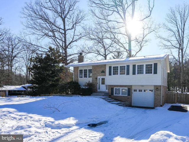 split foyer home featuring a garage