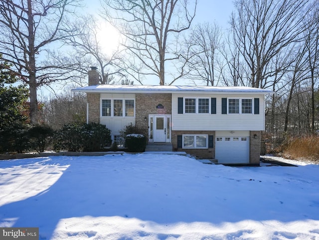 bi-level home featuring a garage