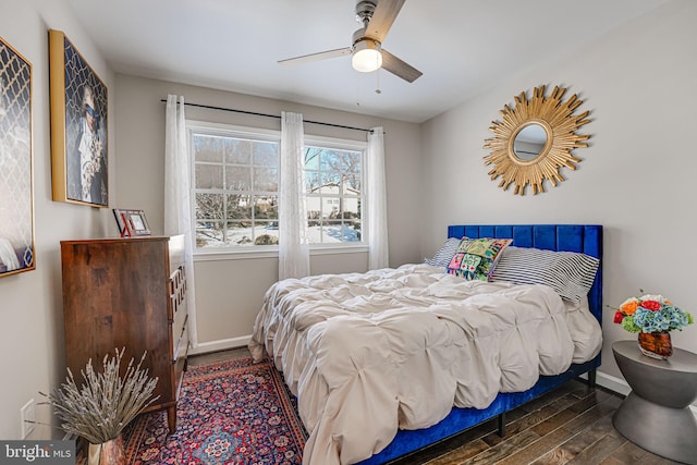 bedroom with ceiling fan and dark wood-type flooring