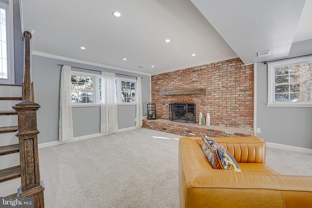 carpeted living room with a brick fireplace and crown molding