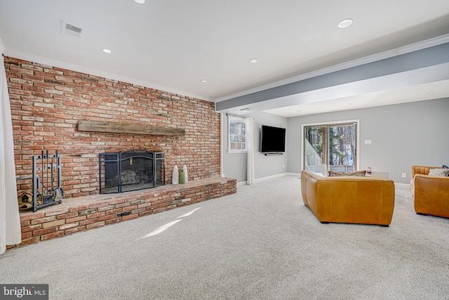 carpeted living room featuring a fireplace and crown molding