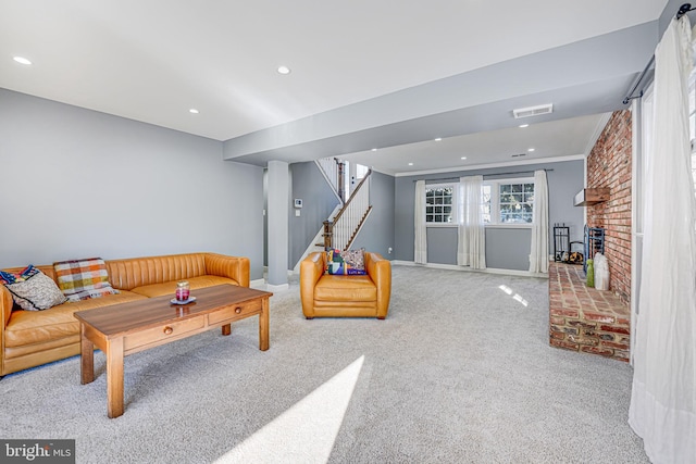 carpeted living room featuring a fireplace