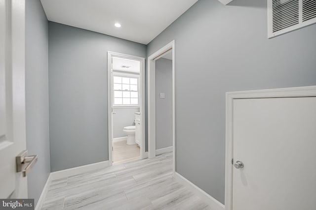 hallway featuring light hardwood / wood-style flooring