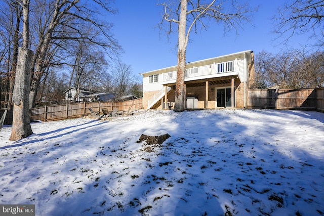 view of snow covered house