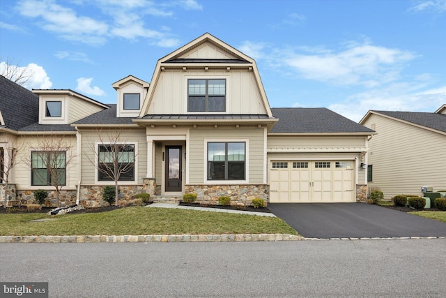 view of front of home featuring central AC unit, a front yard, and a garage