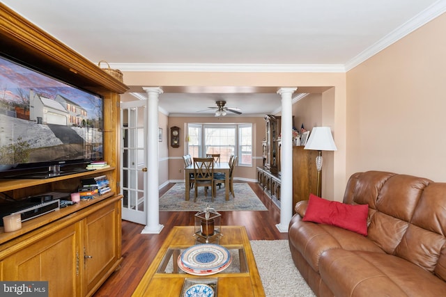 living room with ceiling fan, dark hardwood / wood-style flooring, ornate columns, and ornamental molding