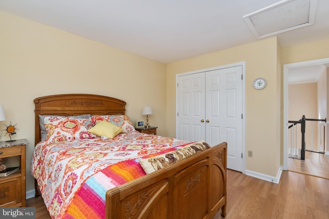 bedroom featuring a closet and light hardwood / wood-style flooring