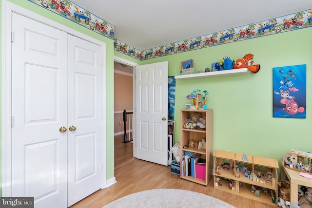 recreation room featuring light hardwood / wood-style floors