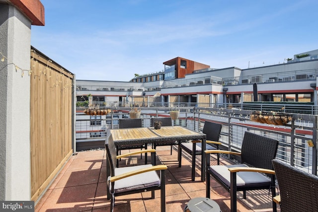 view of patio featuring a balcony