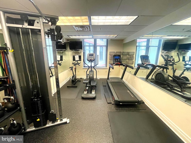 exercise room featuring a drop ceiling