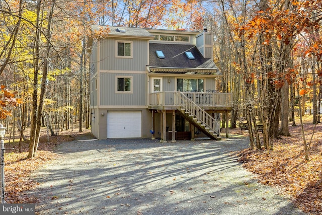 view of front facade with a porch and a garage