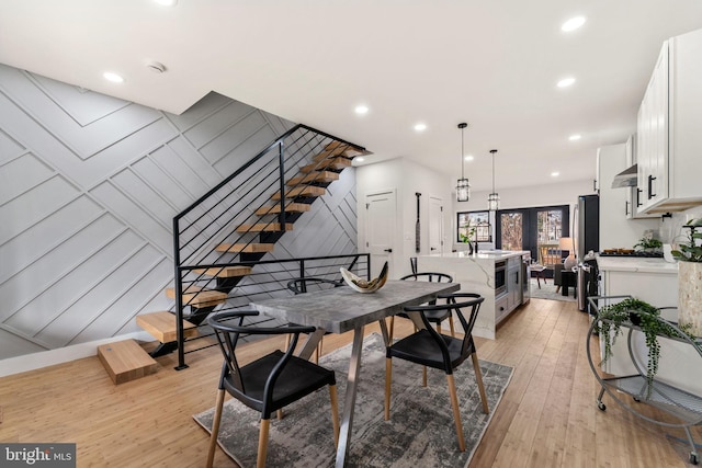 dining room featuring light hardwood / wood-style flooring and sink