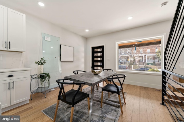 dining area with light hardwood / wood-style flooring