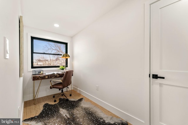 office space with wood-type flooring