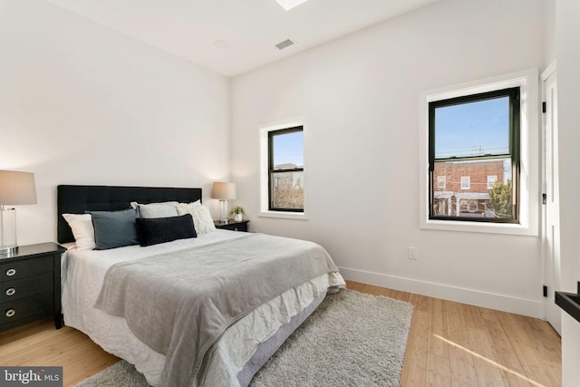 bedroom with light wood-type flooring