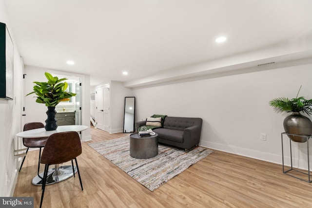 living room with light hardwood / wood-style floors