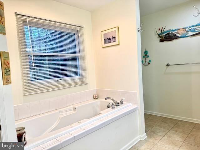 bathroom featuring tile patterned flooring and a washtub