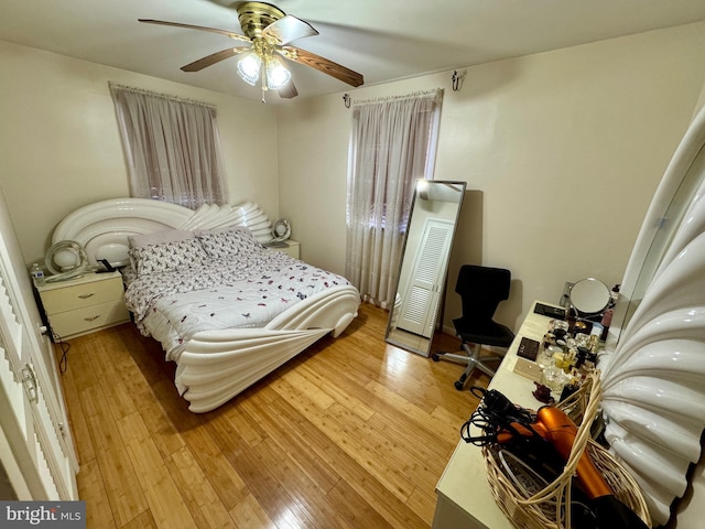 bedroom featuring light wood-style floors and ceiling fan